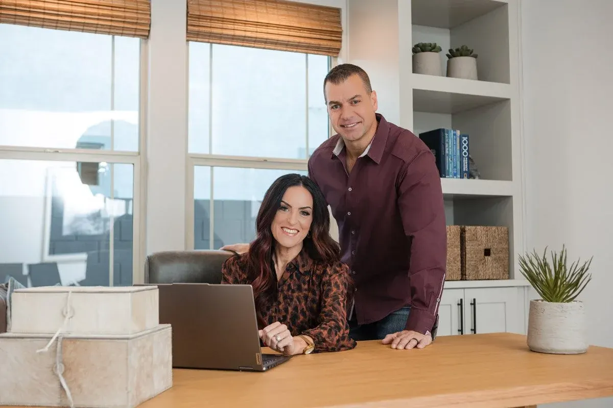 Arizona real estate team photographed at a desk for their brand