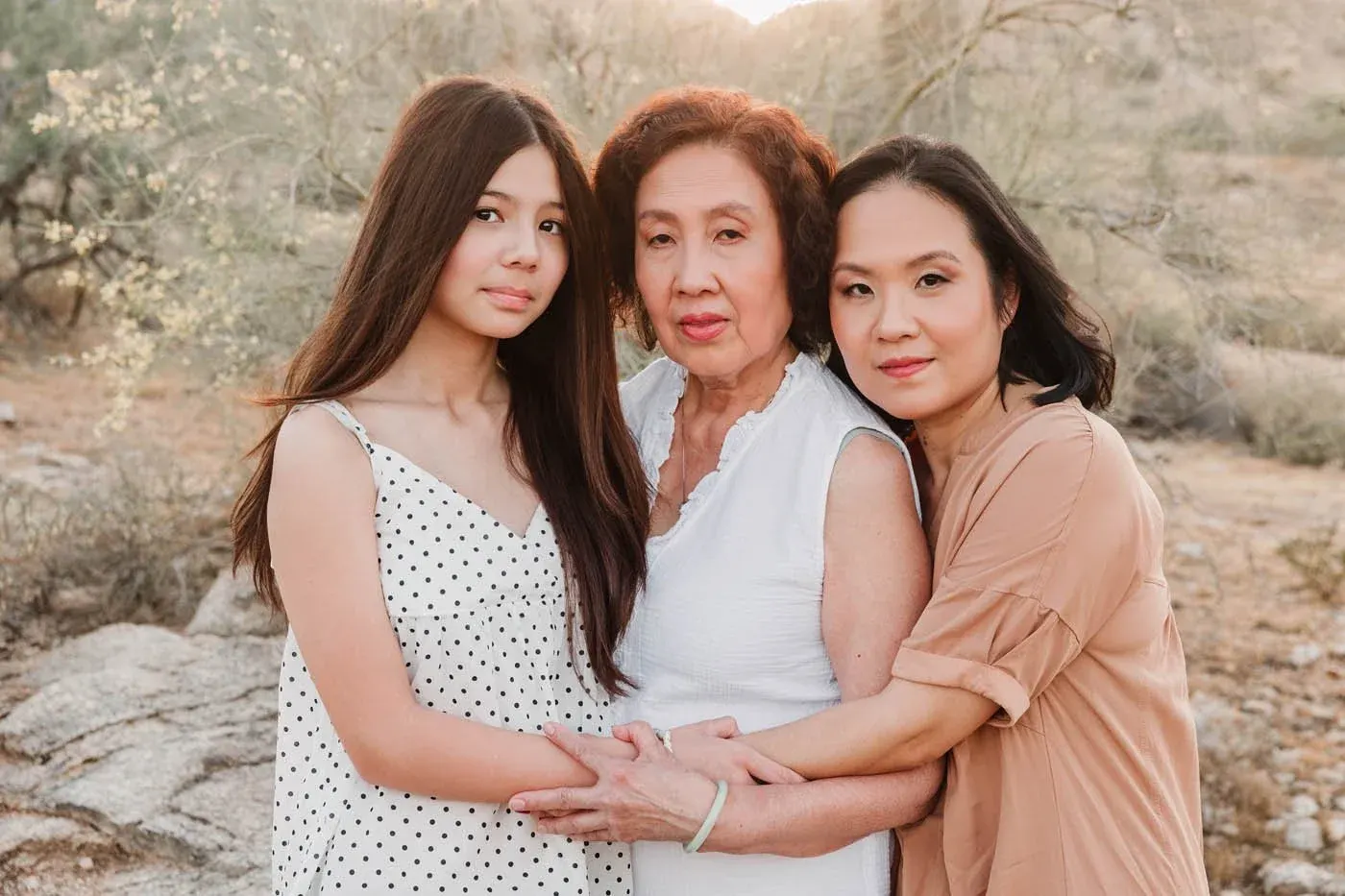 Three generations of women photographed together at sunset in Phoenix
